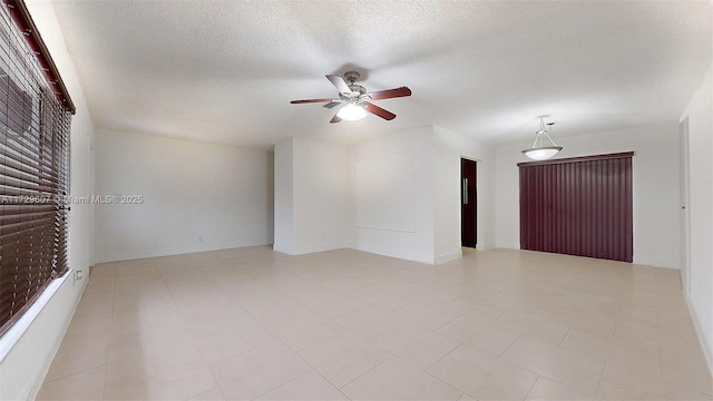 unfurnished room featuring ceiling fan