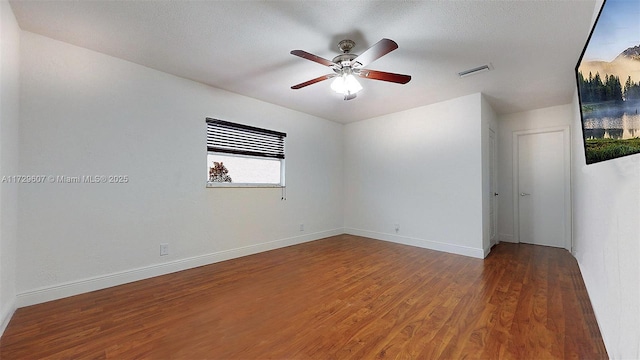 empty room featuring wood-type flooring and ceiling fan