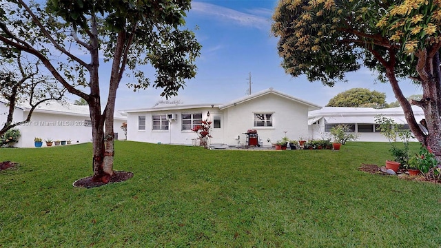 single story home featuring a front yard