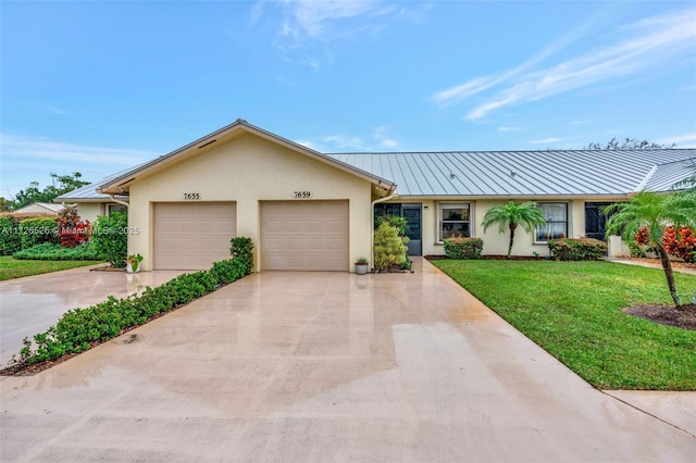 ranch-style home with a front yard and a garage