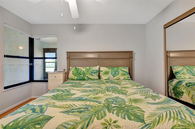 bedroom featuring ceiling fan and wood-type flooring