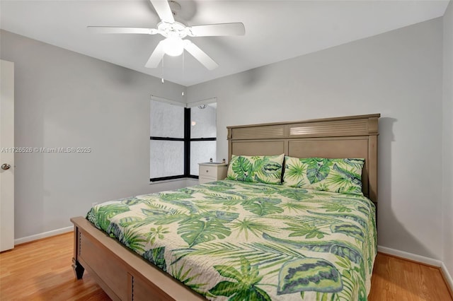 bedroom featuring ceiling fan and light hardwood / wood-style flooring