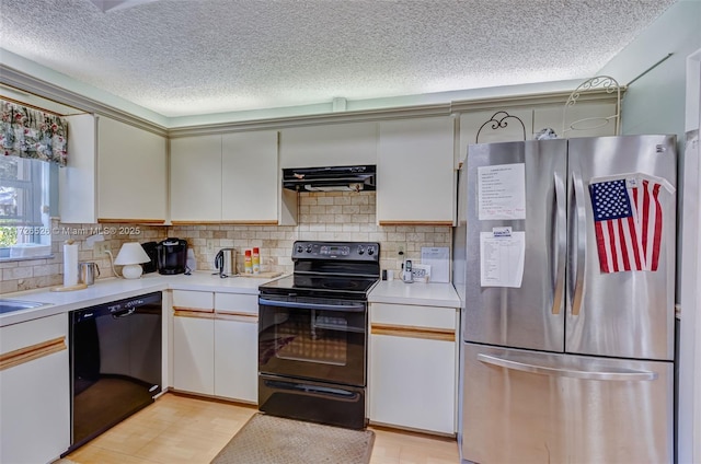 kitchen featuring white cabinetry, exhaust hood, a textured ceiling, black appliances, and decorative backsplash