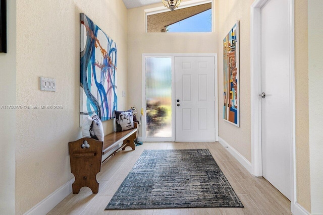 foyer with high vaulted ceiling