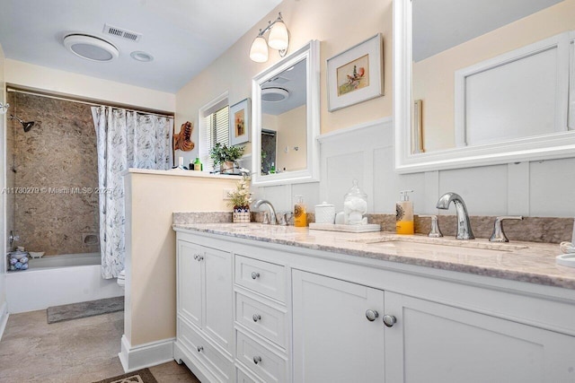 bathroom featuring vanity and shower / bath combo with shower curtain