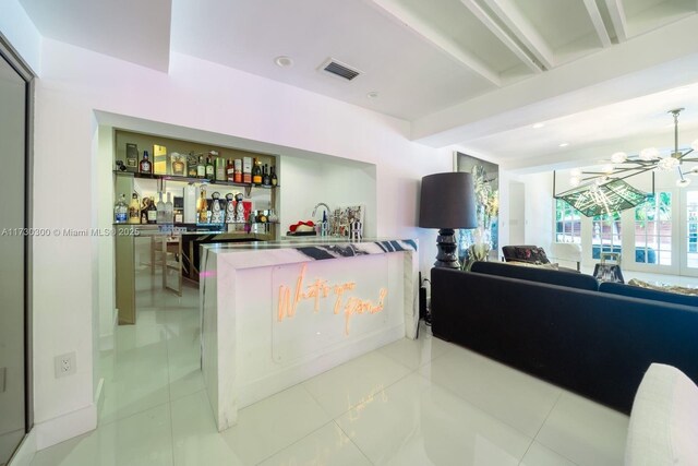 bar with an inviting chandelier