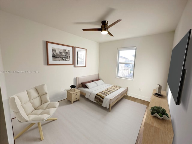 bedroom featuring ceiling fan and hardwood / wood-style flooring