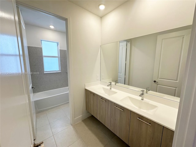 bathroom with bathtub / shower combination, tile patterned floors, and vanity