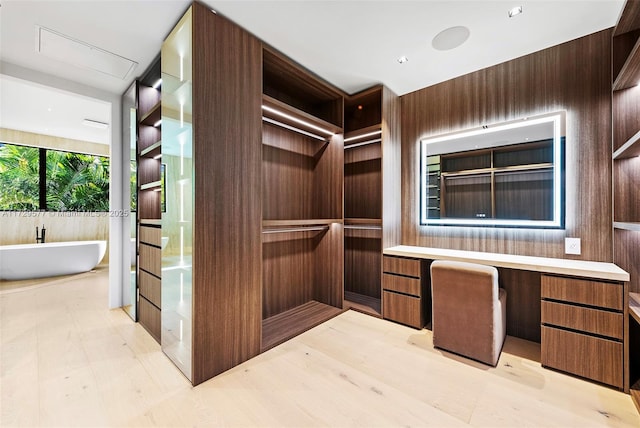 spacious closet with built in desk