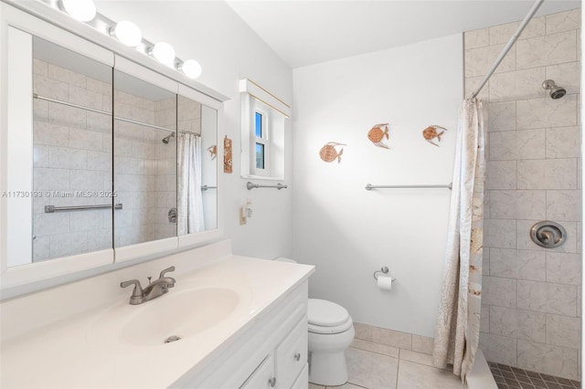 bathroom with vanity, toilet, walk in shower, and tile patterned flooring