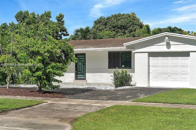 ranch-style house featuring a garage