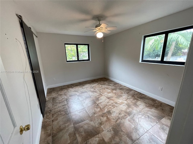 unfurnished bedroom featuring ceiling fan