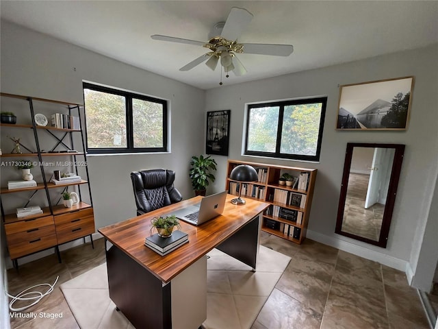 office space featuring ceiling fan and a wealth of natural light