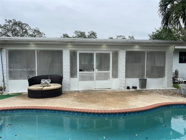 back of house with a sunroom