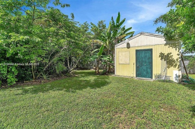 view of outbuilding with a lawn