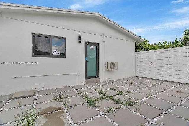 exterior space featuring ac unit and a patio area