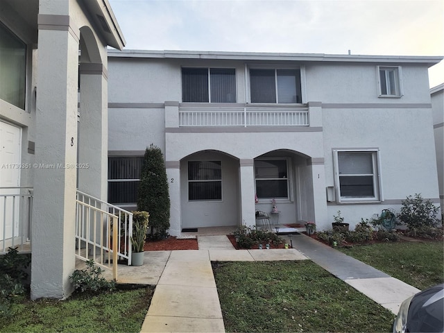 view of front of house with a balcony