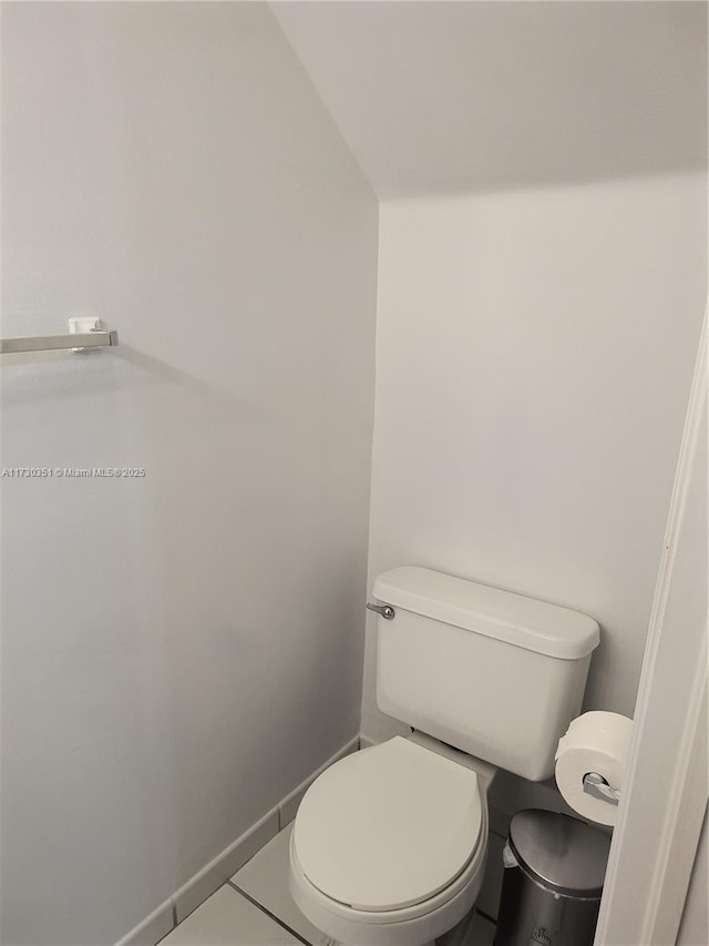 bathroom with tile patterned flooring and toilet