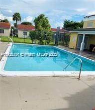 view of swimming pool with a patio area