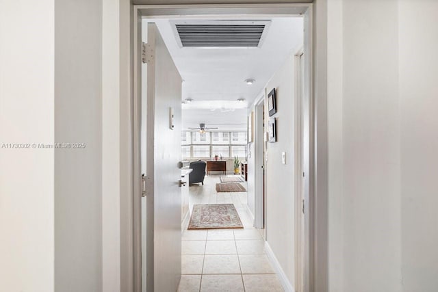 corridor featuring light tile patterned flooring