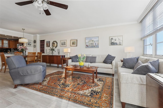 living room with crown molding and ceiling fan