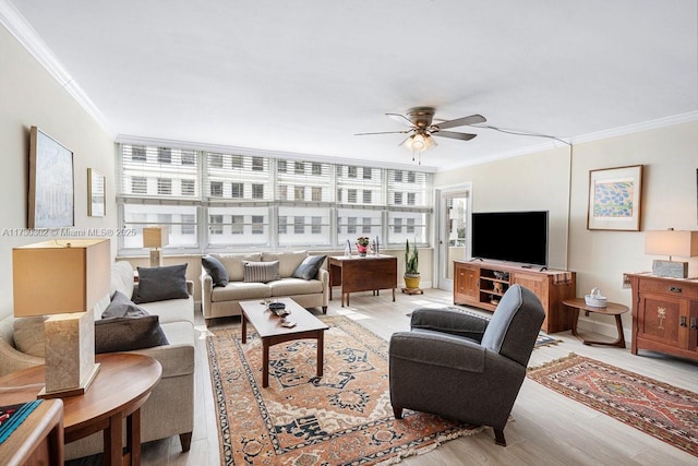 living room featuring crown molding, ceiling fan, and light hardwood / wood-style floors