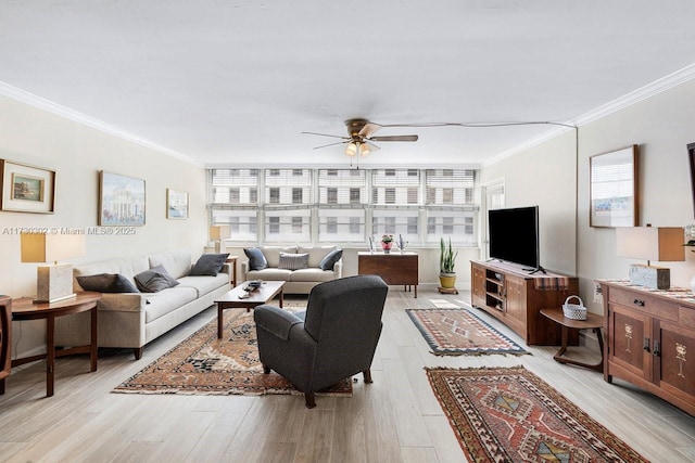 living room with crown molding, ceiling fan, and light hardwood / wood-style floors