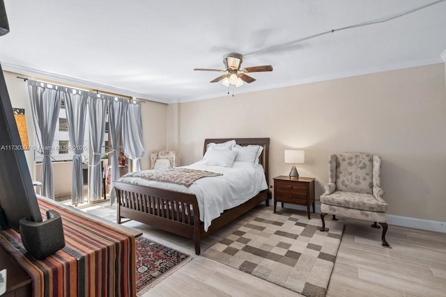 bedroom with access to exterior, ornamental molding, ceiling fan, and light wood-type flooring