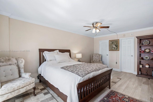 bedroom featuring crown molding, ceiling fan, and light hardwood / wood-style flooring