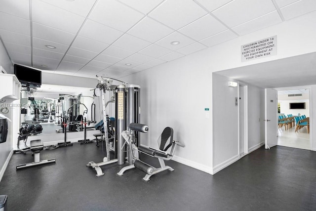 gym featuring a drop ceiling