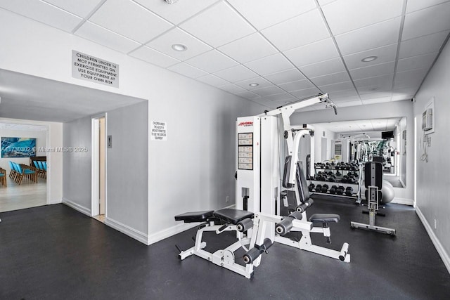 workout area with a drop ceiling