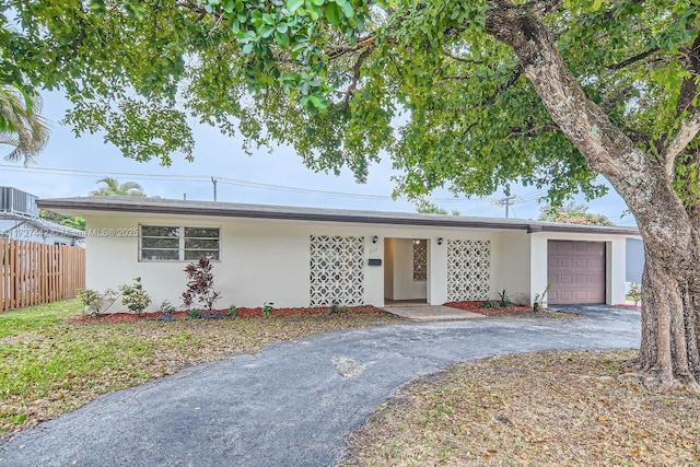 single story home with a garage