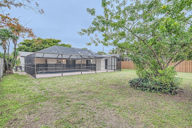 view of yard featuring a pool and a lanai