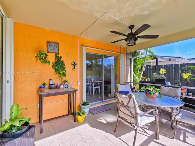 sunroom / solarium with ceiling fan