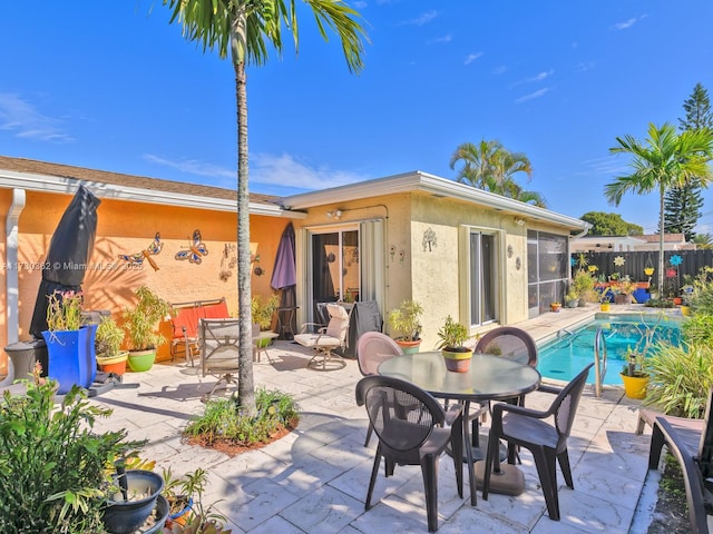 view of patio / terrace with a fenced in pool