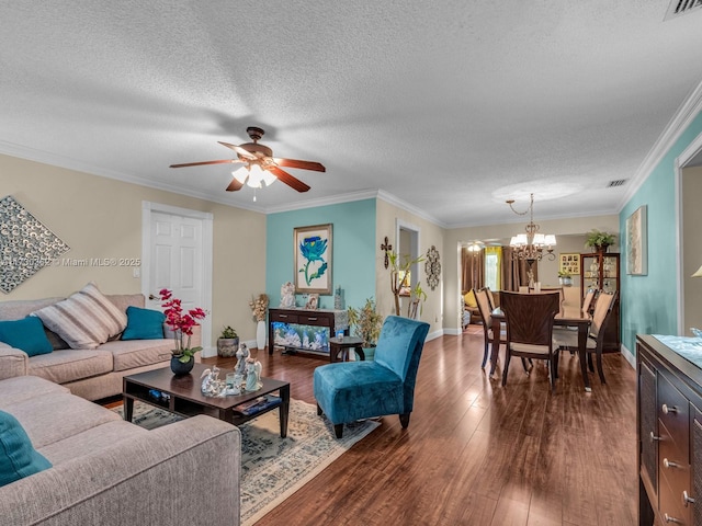 living room featuring a textured ceiling, dark hardwood / wood-style flooring, and crown molding