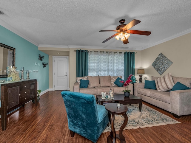 living room with a textured ceiling, dark hardwood / wood-style floors, ceiling fan, and ornamental molding