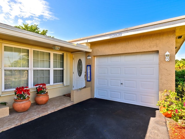 entrance to property with a garage