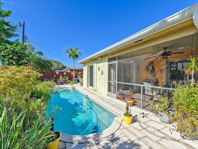 view of pool featuring a patio area and ceiling fan