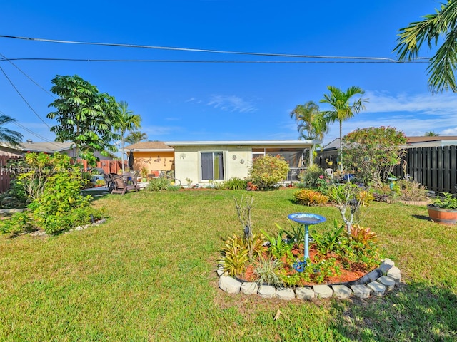 view of yard featuring a sunroom