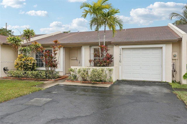 ranch-style home with a garage