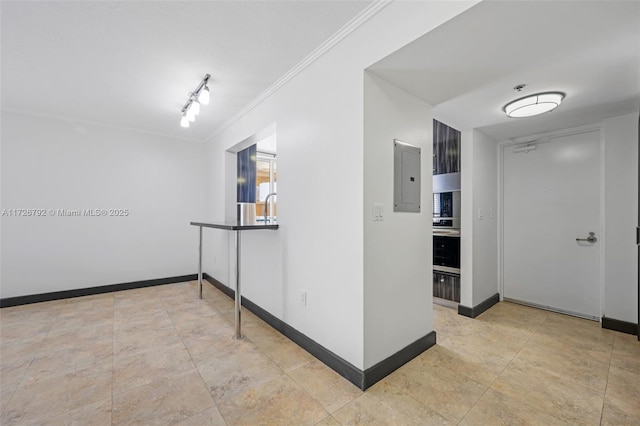 hall featuring rail lighting, electric panel, and ornamental molding