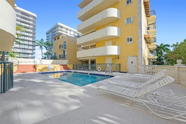 view of pool featuring a patio area