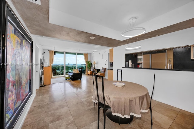 dining room featuring a wall of windows