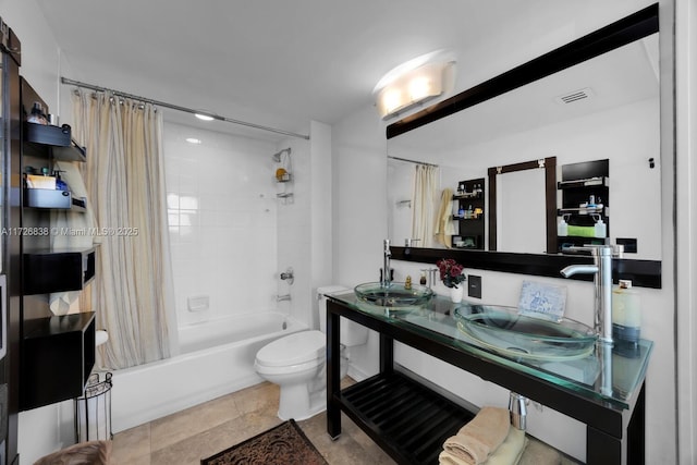 full bathroom featuring toilet, vanity, tile patterned floors, and shower / tub combo with curtain