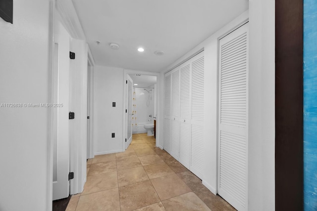 hallway featuring light tile patterned floors