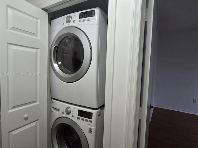 laundry room featuring stacked washing maching and dryer