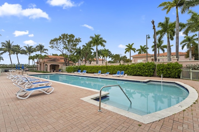 view of swimming pool with a patio area