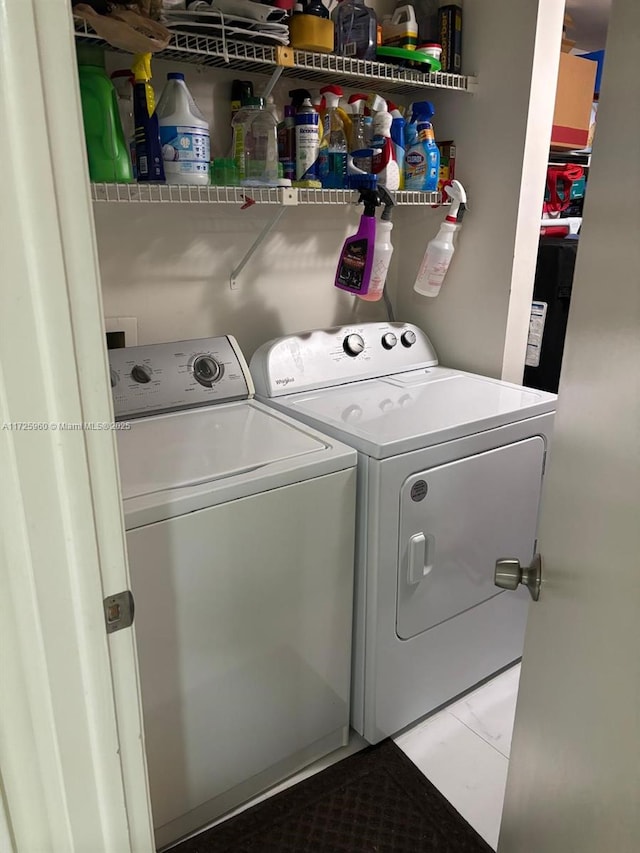 washroom with separate washer and dryer