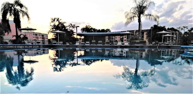 view of pool at dusk